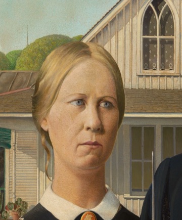 Her sideways glance breaks the rigid pose.