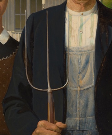 A pitchfork rises through the center of his coat.