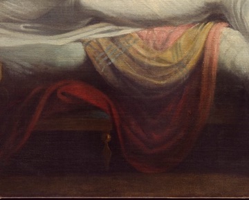 Red folds spill beneath the white dress.