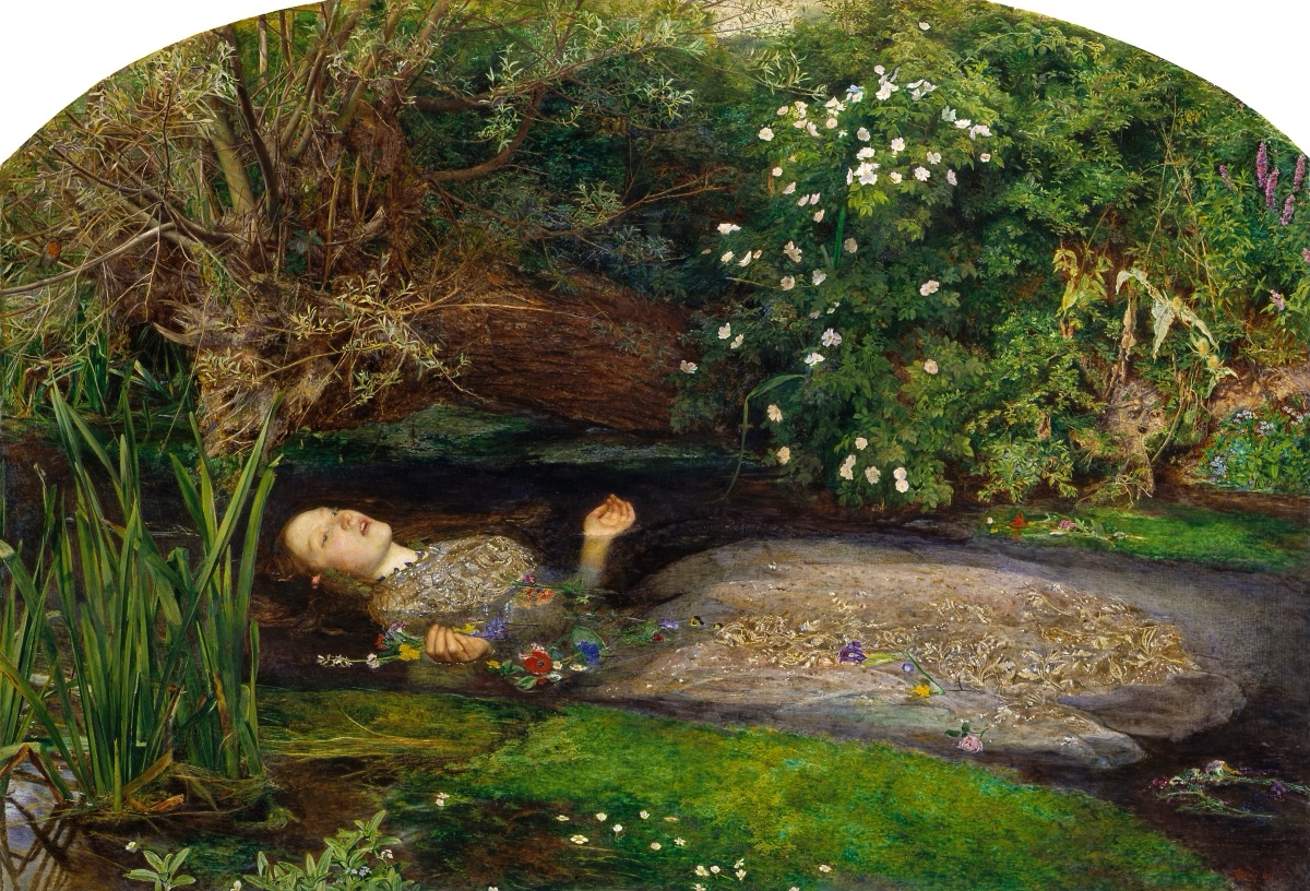Ophelia by John Everett Millais: a young woman in a silvery embroidered dress floats on her back in a dark stream, her face and open hands turned upward and flowers drifting beside her, with reeds on the left, a willow overhead and a dense green bank of plants and white wild roses behind her.