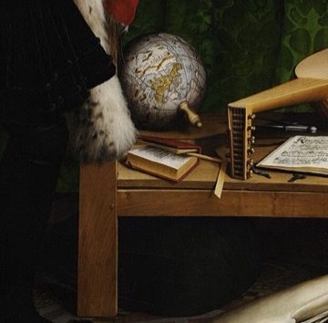 An open arithmetic book lies beside the terrestrial globe.