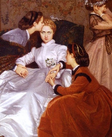 Another kneels and holds the bride's left hand.